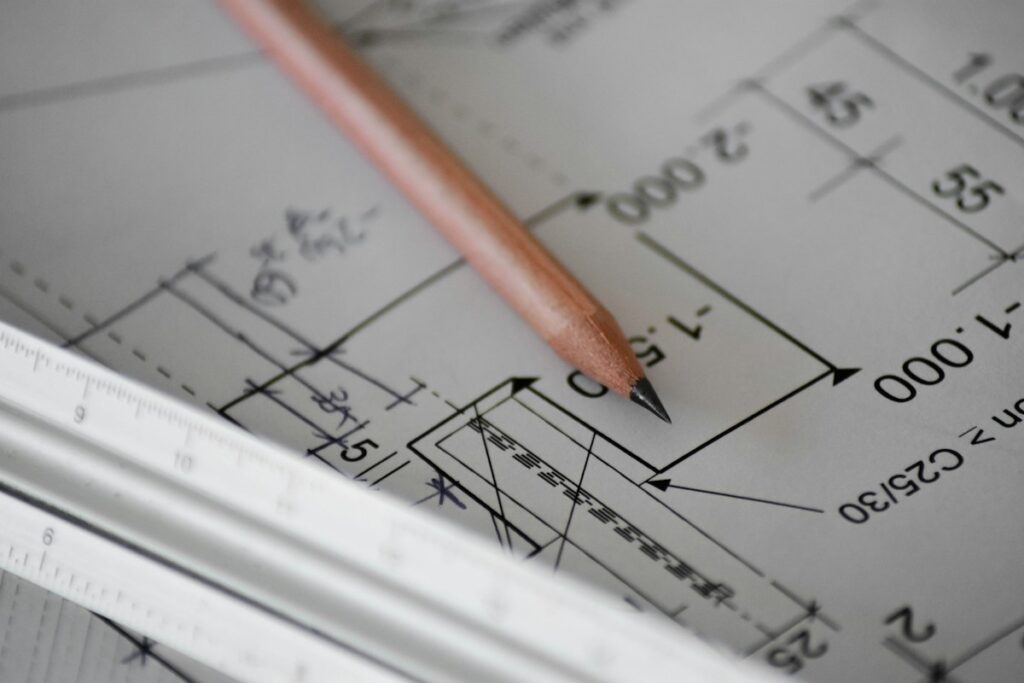Pencil and architectural plan illustrating early technology planning